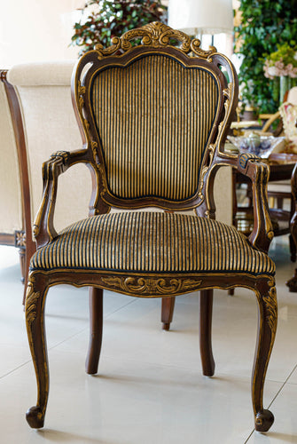 Loius Armchair in neoclassic style with exposed wood and gold gild finish with fine velvet fabric at Casabella Dubai