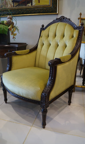 French Louis XVI Carved Walnut Wood Armchair with vase, garland motifs and premium velvet green fabric at Casabella Home Furnishings and Accessories UAE.
