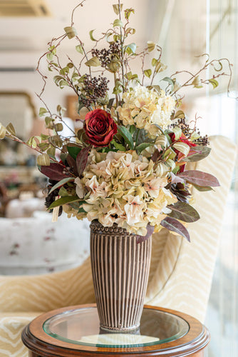 An Artificial flower arrangement with vase at Casabella UAE.