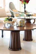 Load image into Gallery viewer, A close up of a round modern Coffee Table with decorative accessories
